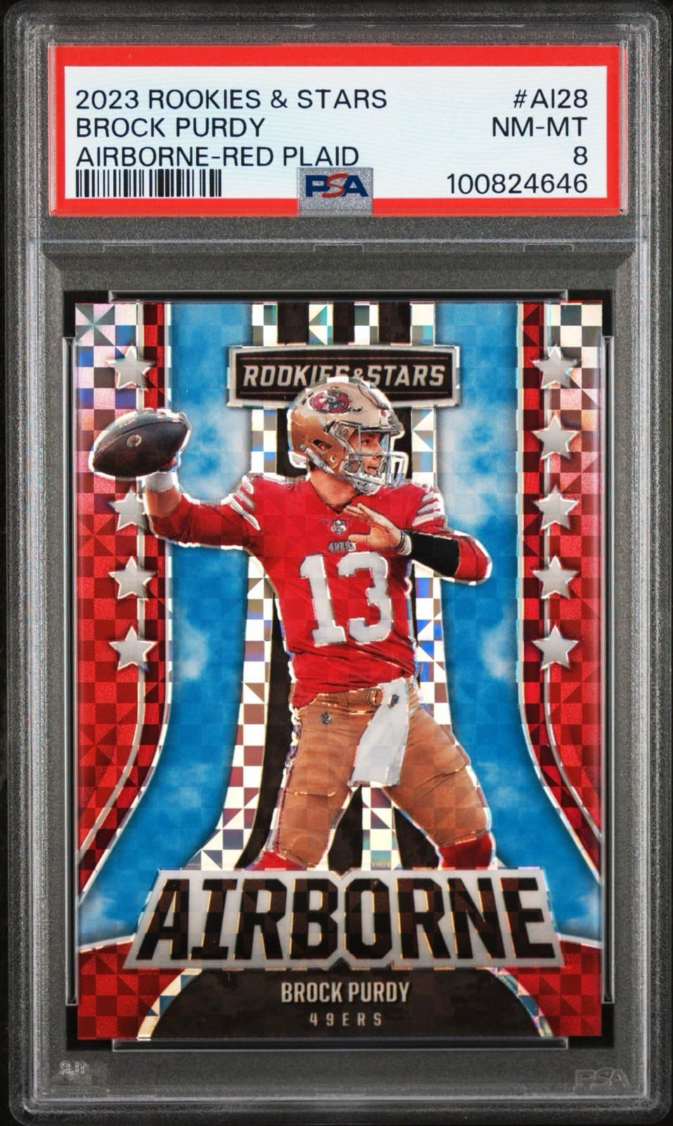 2023 Panini Rookies & Stars - Airborne Red Plaid Prizm #AI-28 Brock Purdy. PSA 8