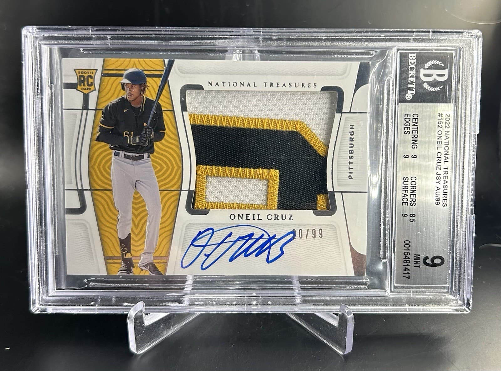 2022 Panini  National Treasures  - Oneil Cruz (RC) Rookie Patch Auto /99. BGS 9